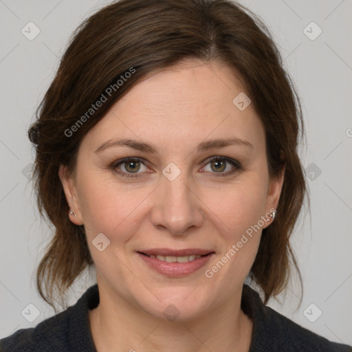 Joyful white adult female with medium  brown hair and grey eyes