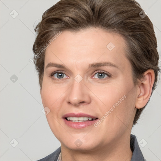 Joyful white adult female with medium  brown hair and grey eyes