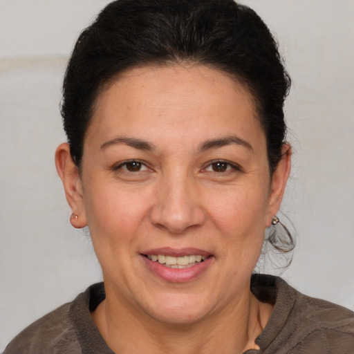 Joyful white adult female with short  brown hair and brown eyes