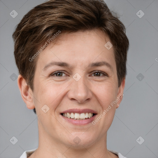 Joyful white adult female with short  brown hair and grey eyes