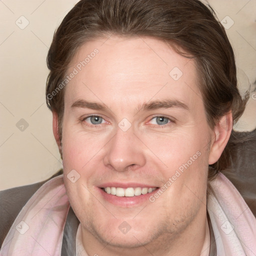 Joyful white adult female with medium  brown hair and blue eyes