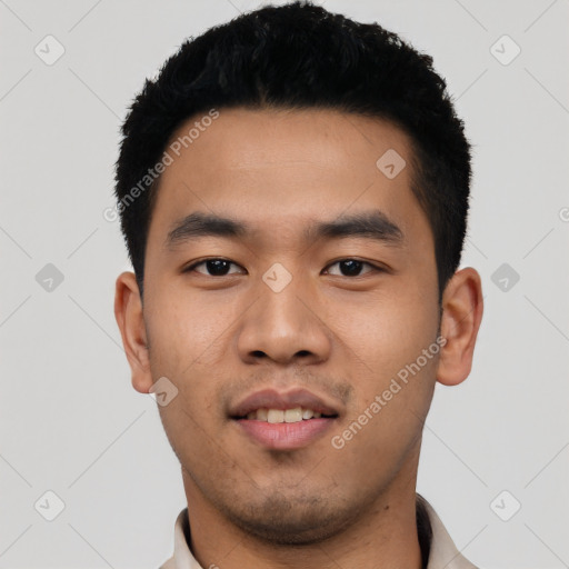 Joyful asian young-adult male with short  black hair and brown eyes