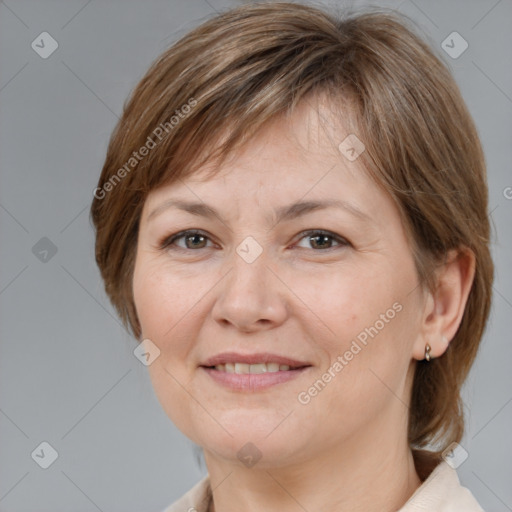 Joyful white adult female with medium  brown hair and brown eyes