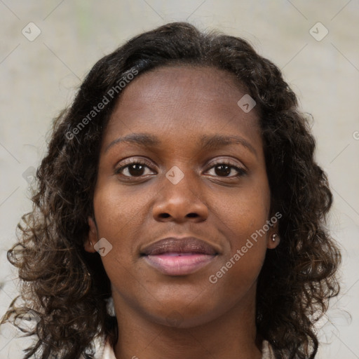 Joyful black young-adult female with medium  brown hair and brown eyes