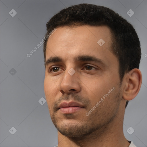 Neutral white young-adult male with short  black hair and brown eyes