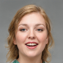 Joyful white young-adult female with medium  brown hair and blue eyes