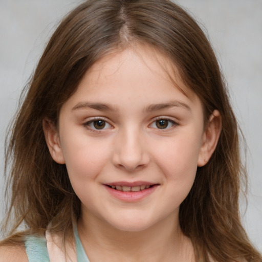 Joyful white child female with medium  brown hair and brown eyes