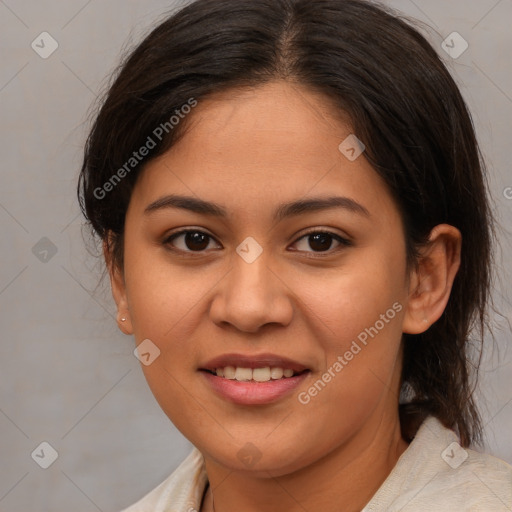 Joyful latino young-adult female with medium  brown hair and brown eyes