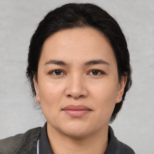 Joyful white young-adult female with medium  brown hair and brown eyes