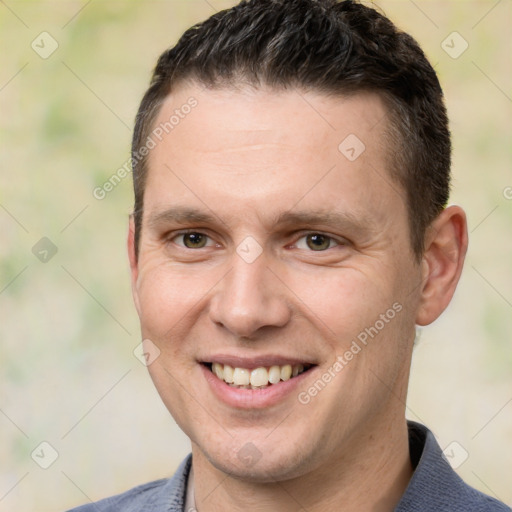 Joyful white adult male with short  brown hair and brown eyes