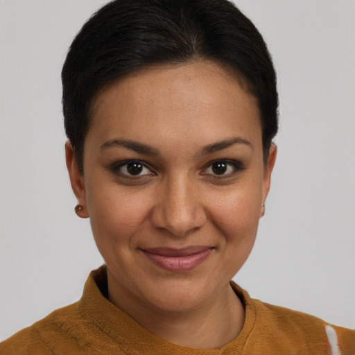 Joyful latino young-adult female with short  brown hair and brown eyes