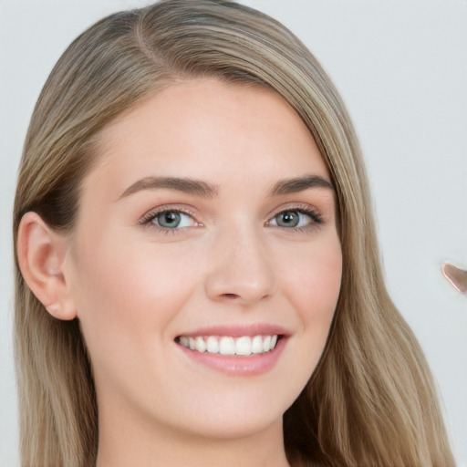 Joyful white young-adult female with long  brown hair and grey eyes