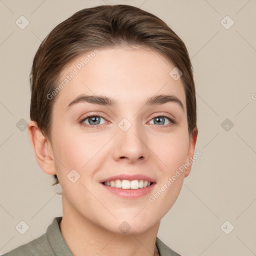 Joyful white young-adult female with short  brown hair and grey eyes