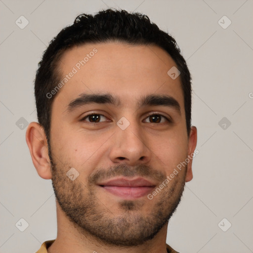 Joyful latino young-adult male with short  brown hair and brown eyes