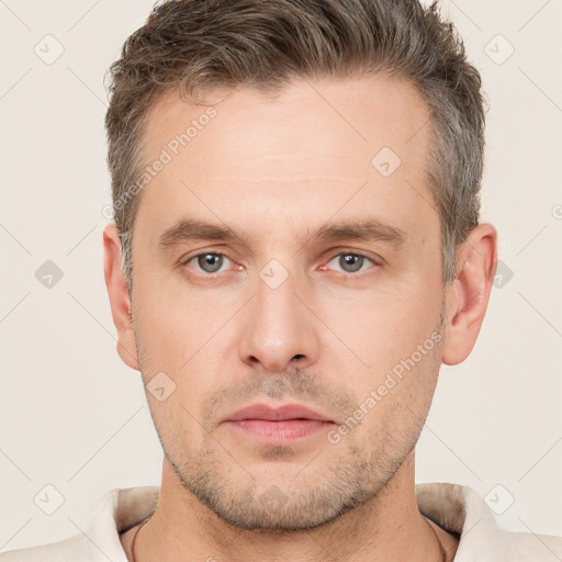 Neutral white young-adult male with short  brown hair and brown eyes