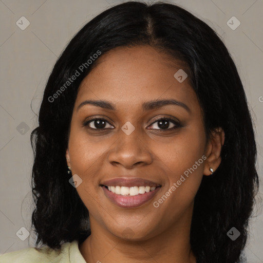 Joyful black young-adult female with medium  brown hair and brown eyes