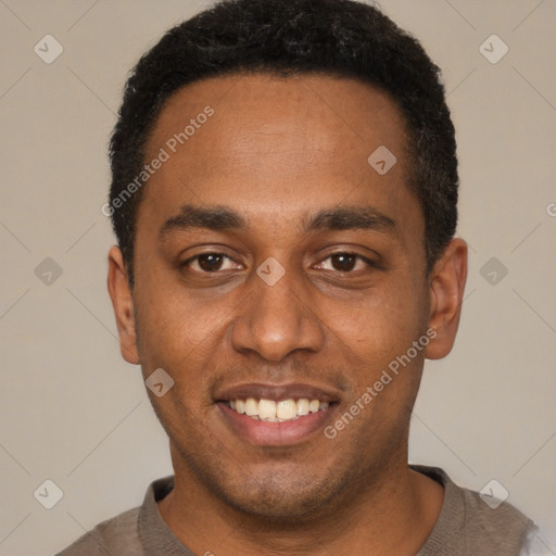 Joyful black young-adult male with short  black hair and brown eyes