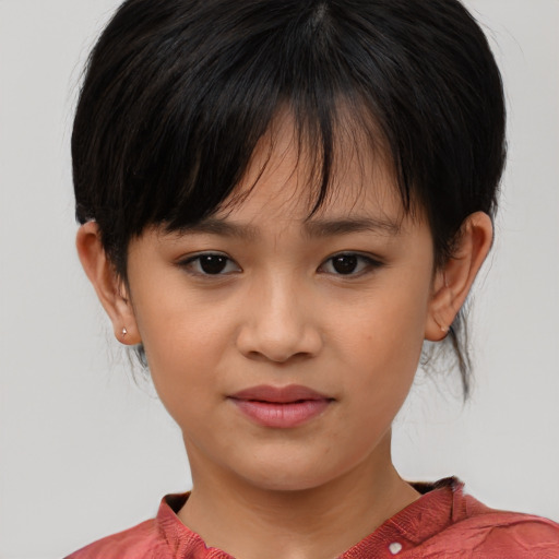 Joyful asian child female with medium  brown hair and brown eyes