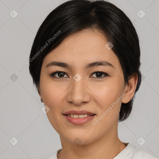 Joyful latino young-adult female with short  black hair and brown eyes