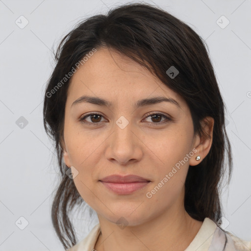 Joyful latino young-adult female with medium  brown hair and brown eyes