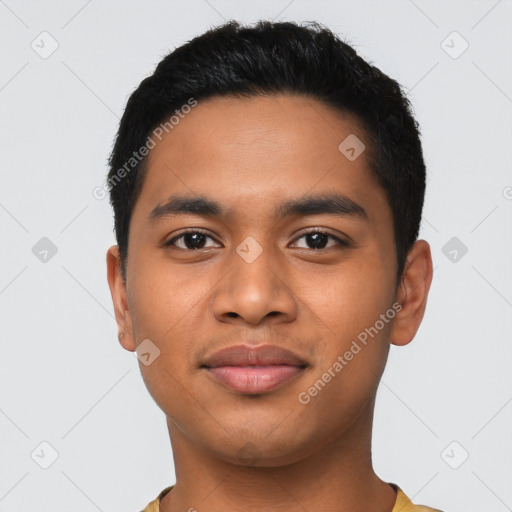 Joyful latino young-adult male with short  black hair and brown eyes