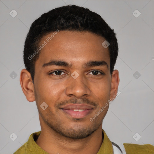 Joyful black young-adult male with short  brown hair and brown eyes