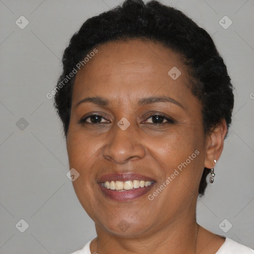 Joyful black adult female with short  brown hair and brown eyes