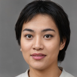 Joyful asian young-adult female with medium  black hair and brown eyes