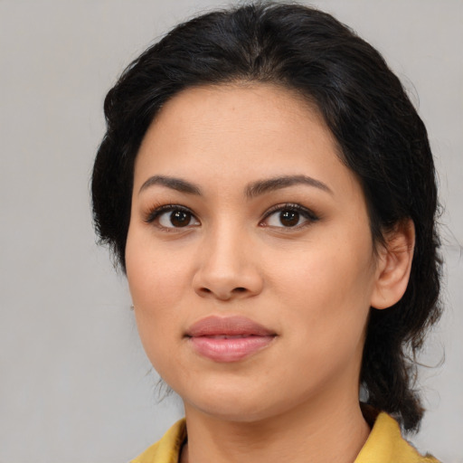 Joyful asian young-adult female with medium  brown hair and brown eyes