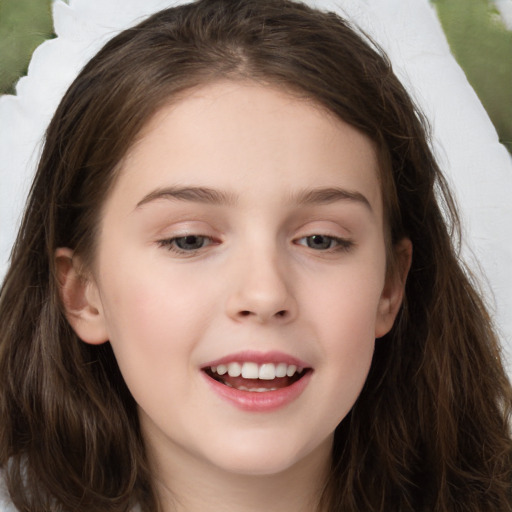 Joyful white child female with long  brown hair and brown eyes