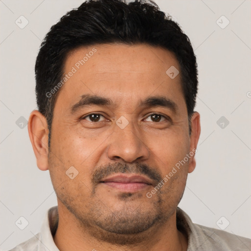 Joyful latino adult male with short  black hair and brown eyes