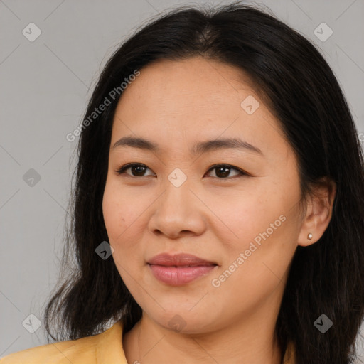 Joyful asian young-adult female with long  brown hair and brown eyes