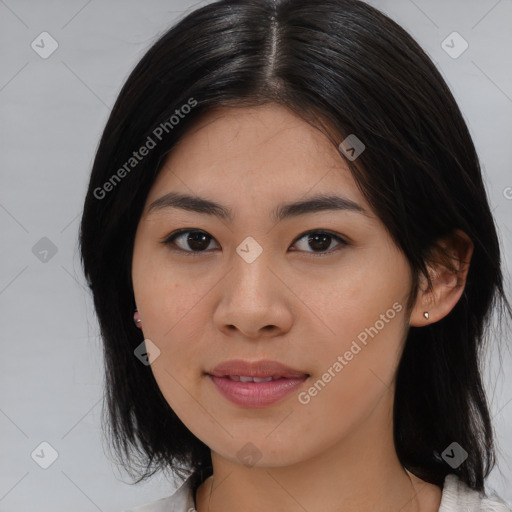 Joyful asian young-adult female with medium  black hair and brown eyes