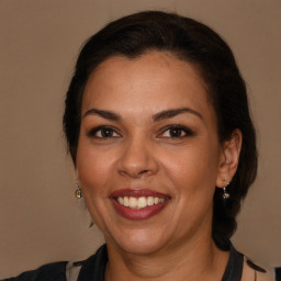 Joyful white adult female with medium  brown hair and brown eyes