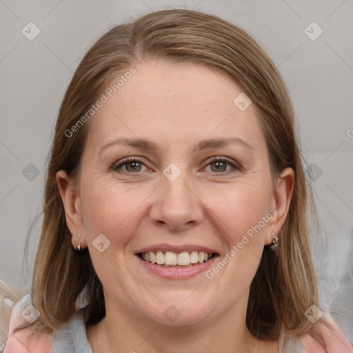 Joyful white adult female with medium  brown hair and grey eyes