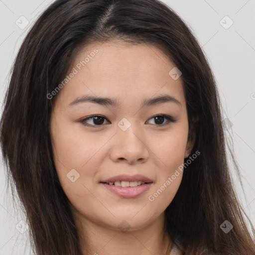 Joyful asian young-adult female with long  brown hair and brown eyes