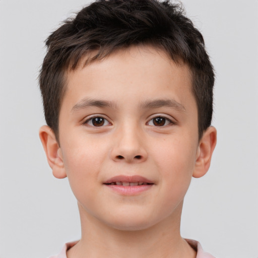 Joyful white child male with short  brown hair and brown eyes