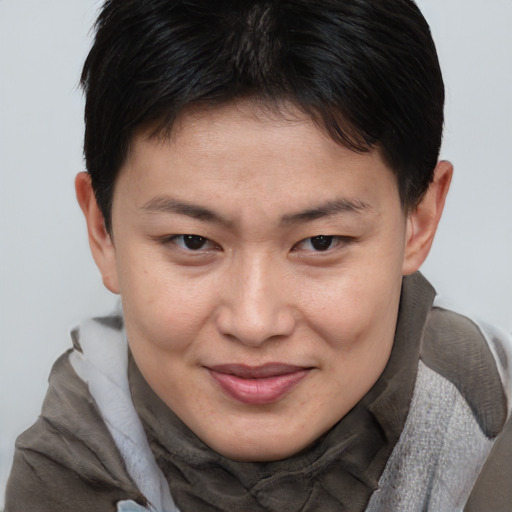 Joyful asian young-adult female with short  brown hair and brown eyes