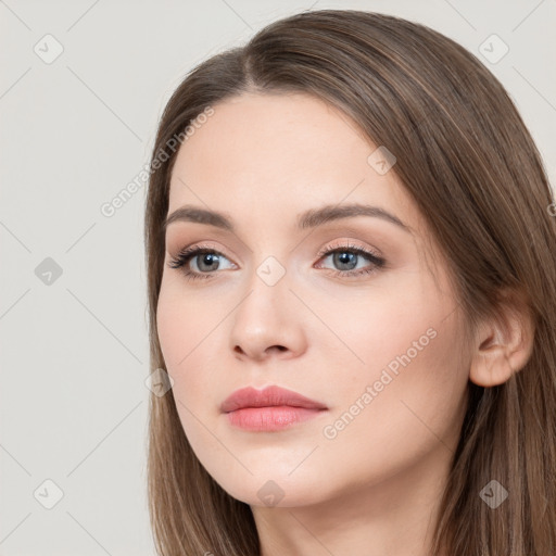 Neutral white young-adult female with long  brown hair and brown eyes