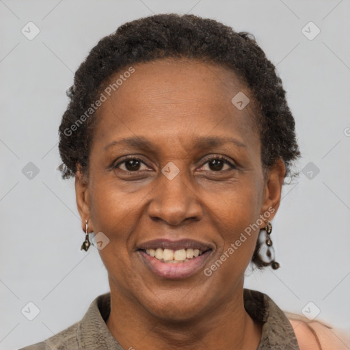 Joyful black adult female with short  brown hair and brown eyes