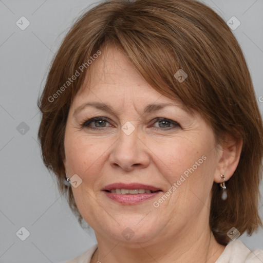 Joyful white adult female with medium  brown hair and grey eyes