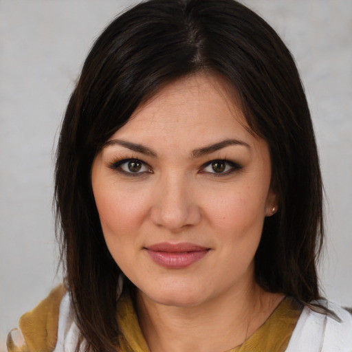 Joyful white young-adult female with medium  brown hair and brown eyes