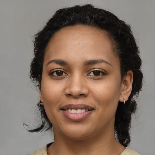 Joyful latino young-adult female with medium  black hair and brown eyes