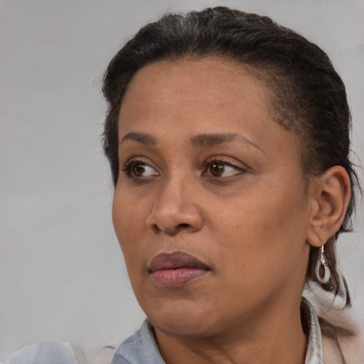 Neutral black adult female with short  brown hair and brown eyes