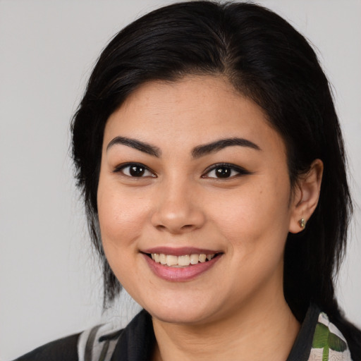 Joyful asian young-adult female with medium  black hair and brown eyes