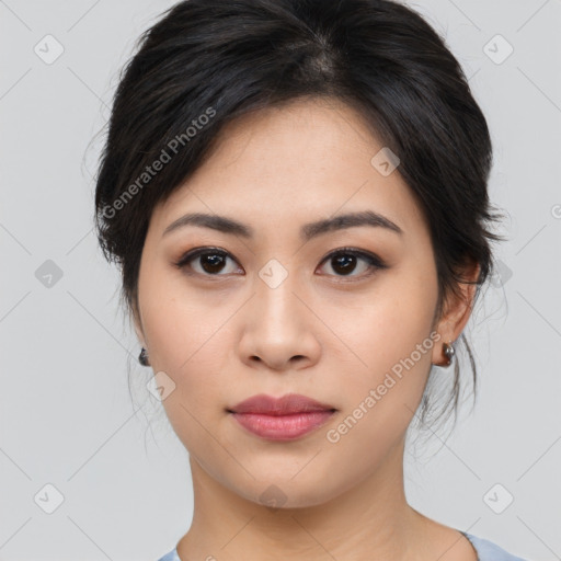 Joyful asian young-adult female with medium  black hair and brown eyes