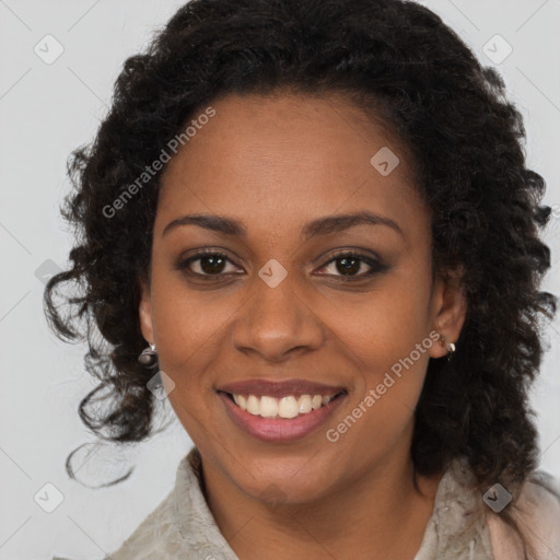 Joyful black young-adult female with medium  brown hair and brown eyes