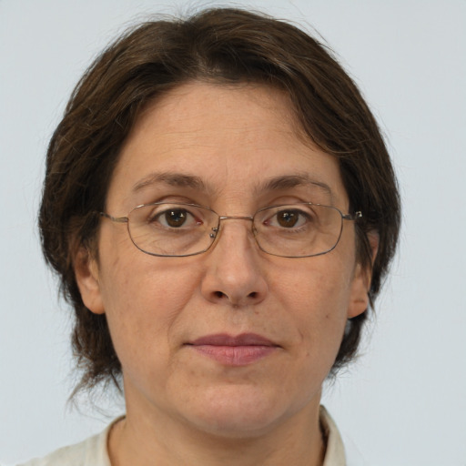 Joyful white middle-aged female with short  brown hair and brown eyes