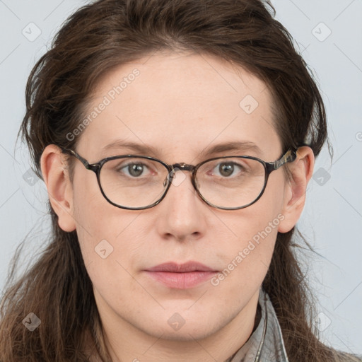 Joyful white young-adult female with long  brown hair and blue eyes