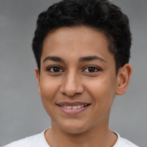 Joyful latino young-adult female with short  brown hair and brown eyes